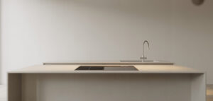 Modernt minimalistiskt kök med köksö i vitt.