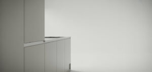 Minimalistiskt vitt kök med vit skåpsdörr